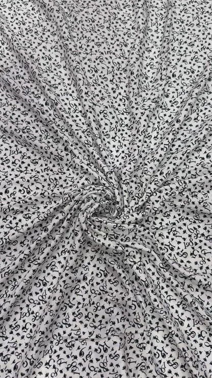 Buy Viscose Modal White Base Numeric Printed Fabric